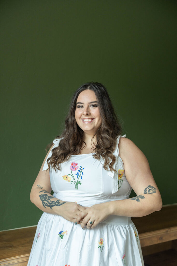 Lexi Stover of Hagan Home Team smiling during a professional real estate portrait.