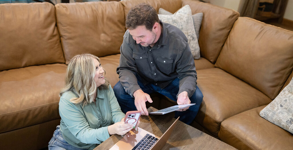 Local realtors meeting with clients to discuss buying or selling a home.