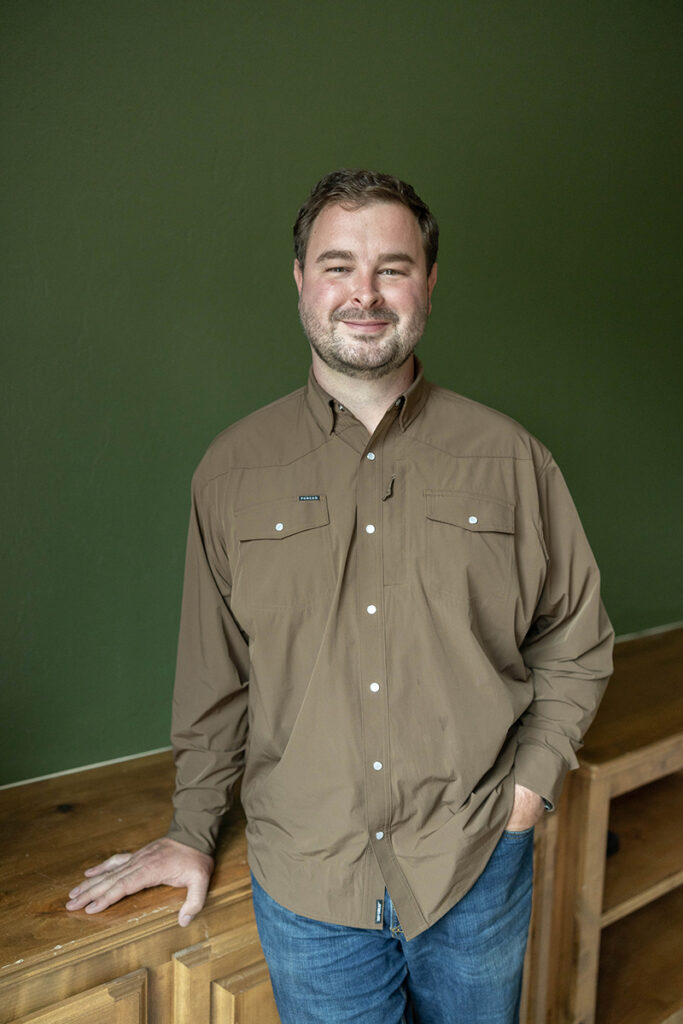 Jon Hagan of Hagan Home Team smiling during a professional real estate portrait.