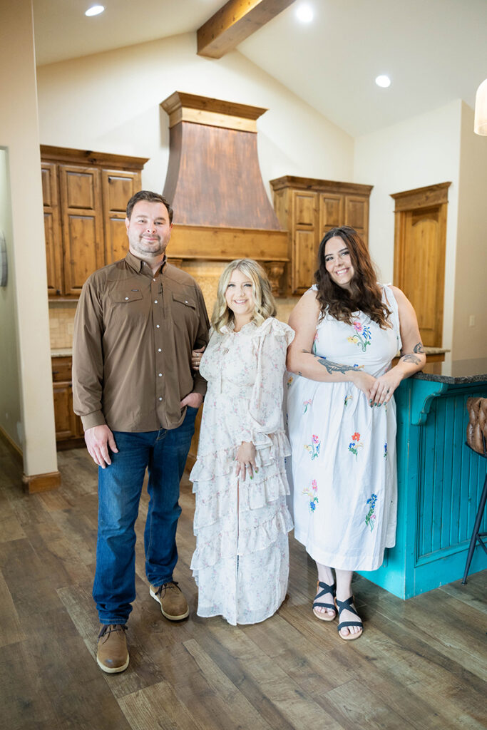 Hagan Home Team members standing together inside a beautiful home.